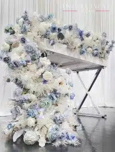 blue flower garland hanging from table min blue flower garland hanging from table min