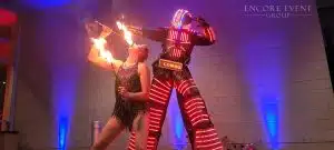 dancing robot with fire performer min scaled dancing robot with fire performer min scaled