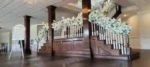 flowers on wedding stair railings min scaled flowers on wedding stair railings min scaled