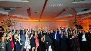 Photo of wedding dance floor packed with guests Photo of wedding dance floor packed with guests
