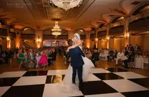 Bride & groom first dance on Encore checkered floor Bride & groom first dance on Encore checkered floor