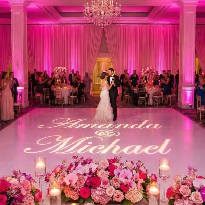 Guests dancing inside Louisville wedding monogram projection