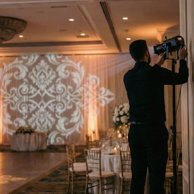 Technician adjusting breakup pattern gobo lights, Louisville wedding