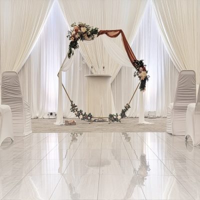 LED uplights enhancing wedding backdrop in Louisville ballroom