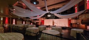wedding_with_drapes_hanging_from_truss-min