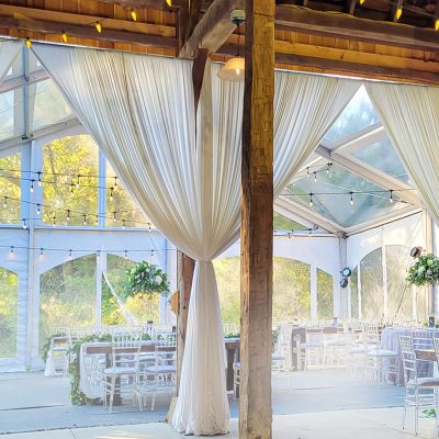 String lights and draping enhancing a rustic Kentuckiana wedding venue