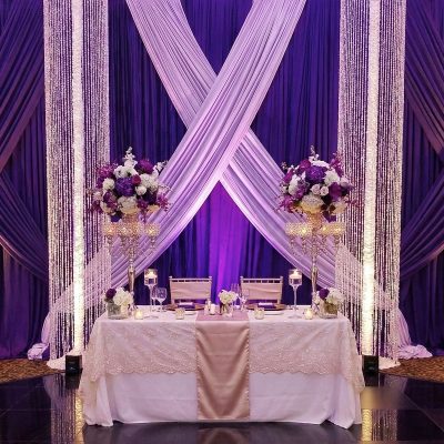 Beaded crystal chandelier pillars flanking a sweetheart table at a Louisville-area wedding venue