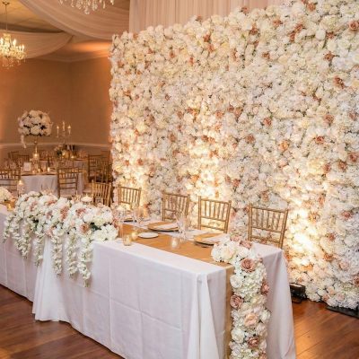 Flower wall behind head table setup