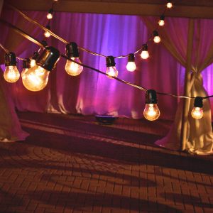 Bistro style wedding string lights with warm Edison bulbs
