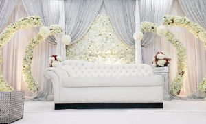 Floral backdrops with draping that add depth and elegant photo appeal
