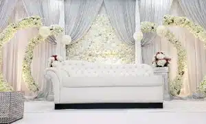 Floral backdrops with draping that add depth and elegant photo appeal Floral backdrops with draping that add depth and elegant photo appeal